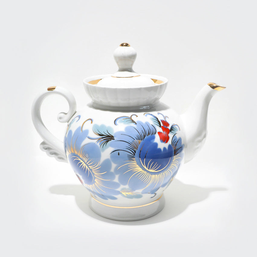 Vintage porcelain teapot with blue flowers